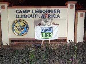 Erik with the Donate Life flag in Djibouti.